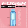 Coconut cupcake Switch Pro pod by Foger with a clear 19mL tank beside the reusable power bank dock