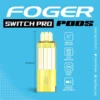 Frozen banana Switch Pro pod by Foger with a clear 19mL tank clicked into the magnetic charging dock