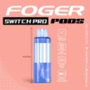 Frozen blueberry Switch Pro pod by Foger showing the clear 19mL tank beside the magnetic charging dock