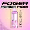 Frozen strawberry grapefruit pod by Foger with a clear 19mL tank next to the Switch Pro magnetic charging dock