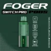 Icy mint Switch Pro pod by Foger with a clear 19mL tank next to the 850mAh magnetic power bank
