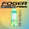 Mango pineapple refresher pod by Foger with a transparent 19mL tank seated on the Switch Pro power bank