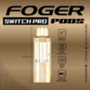 Peach slush Switch Pro pod by Foger with a clear 19mL tank seated on the magnetic charging dock