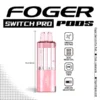 Pink lemonade Switch Pro pod by Foger with a clear 19mL tank clicked into the magnetic charging dock