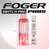 Raspberry watermelon pod clicked into the Foger Switch Pro dock with its clear 19mL tank on show